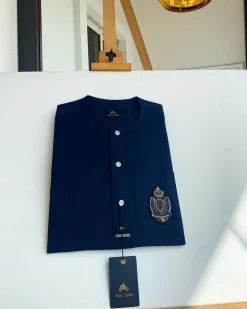 A midnight blue, front flap, hand embroidery patch detailing, and Swarovski button African Kaftan