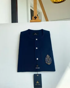 A midnight blue, front flap, hand embroidery patch detailing, and Swarovski button African Kaftan