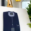 A midnight blue pencil stripe African traditional senator kaftan native.