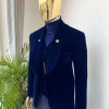 A midnight blue shawl lapel soaked velvet tuxedo suit