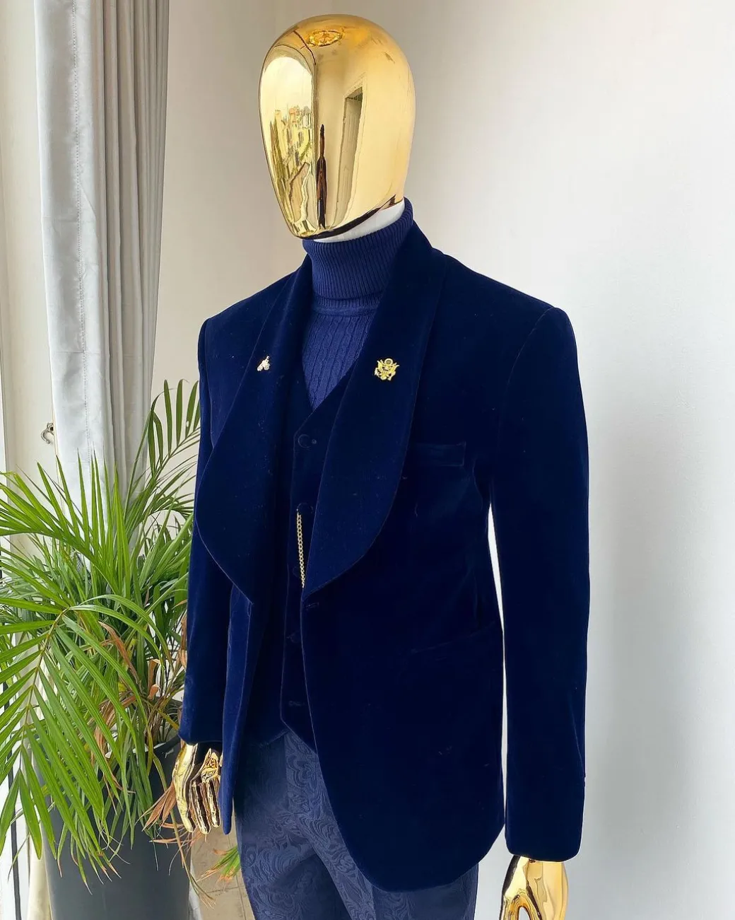 A midnight blue shawl lapel soaked velvet tuxedo suit