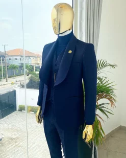 A midnight blue shawl lapel soaked velvet tuxedo suit
