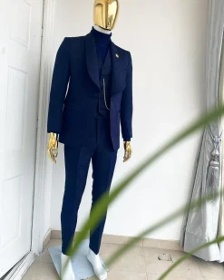 A midnight blue shawl lapel soaked velvet tuxedo suit