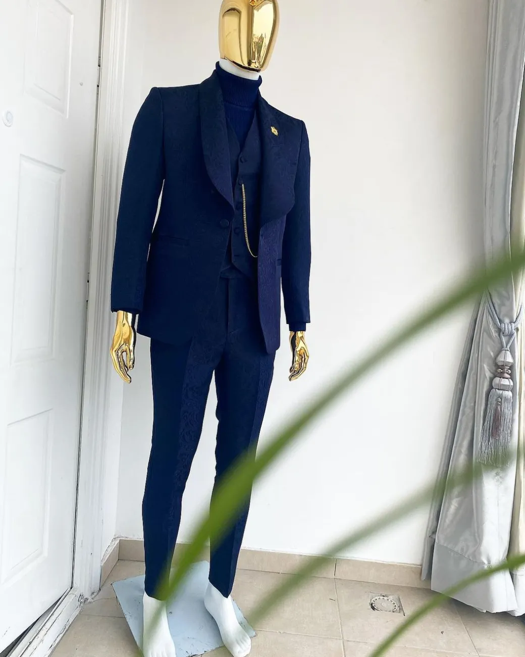 A midnight blue shawl lapel soaked velvet tuxedo suit