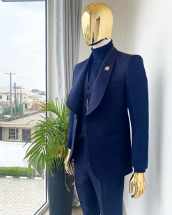 A midnight blue shawl lapel soaked velvet tuxedo suit