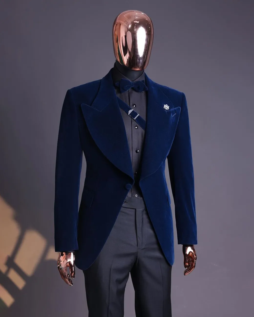 A Midnight Blue, Soaked Velvet Fabric, Knitted, Wide Peak Lapel Tuxedo Suit.