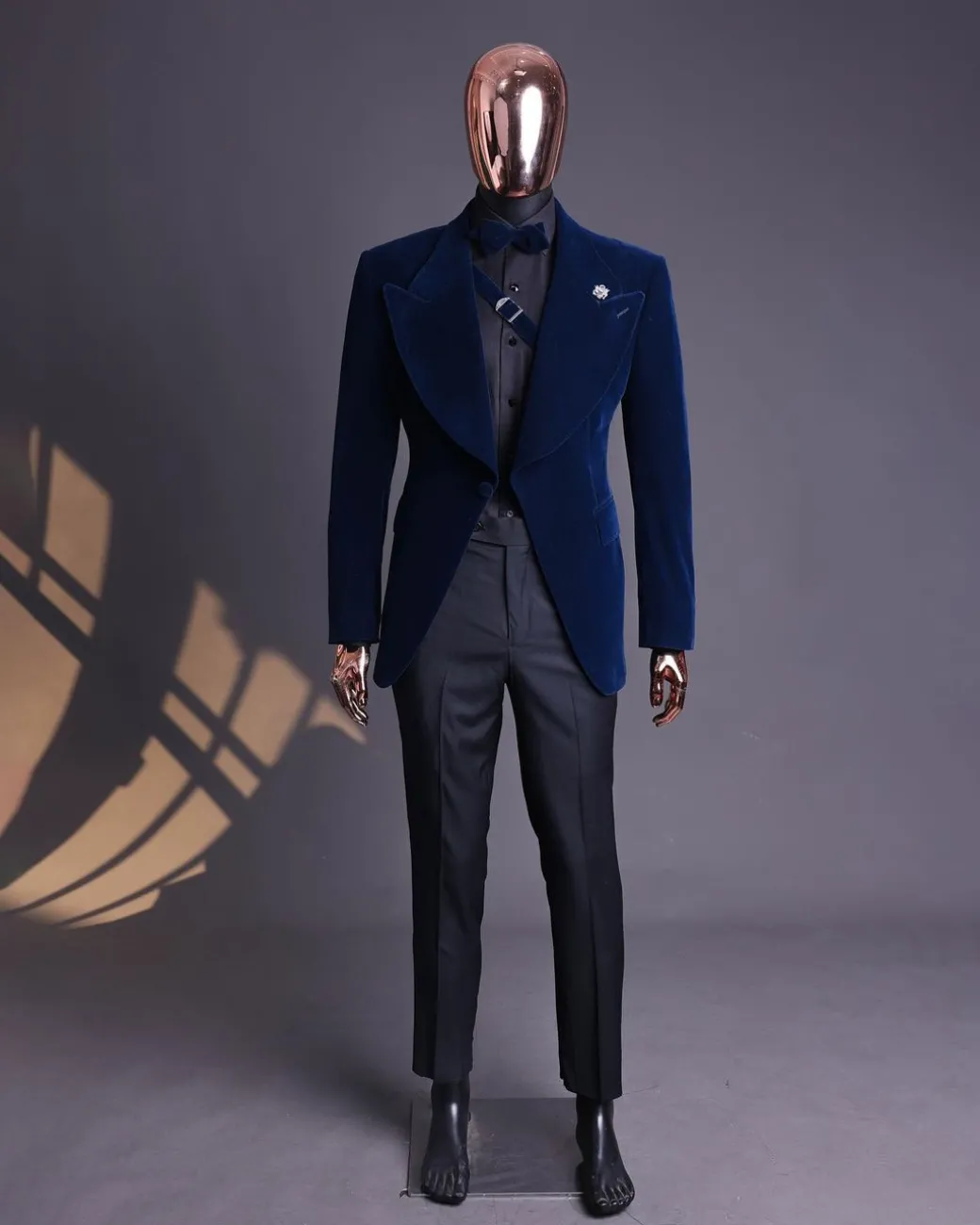A Midnight Blue, Soaked Velvet Fabric, Knitted, Wide Peak Lapel Tuxedo Suit.