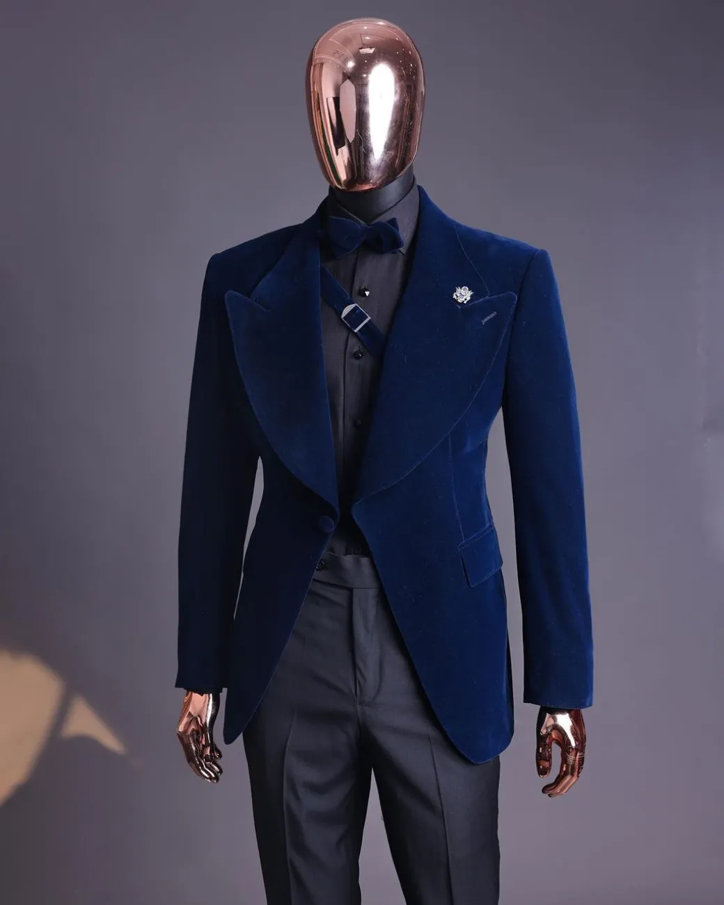 A Midnight Blue, Soaked Velvet Fabric, Knitted, Wide Peak Lapel Tuxedo Suit.