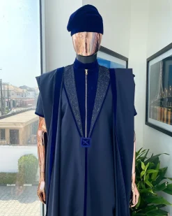 A Midnight blue, vehicular lapelled with zip line flap & navy blue soaked Italian velvet mix embroidery design details agbada
