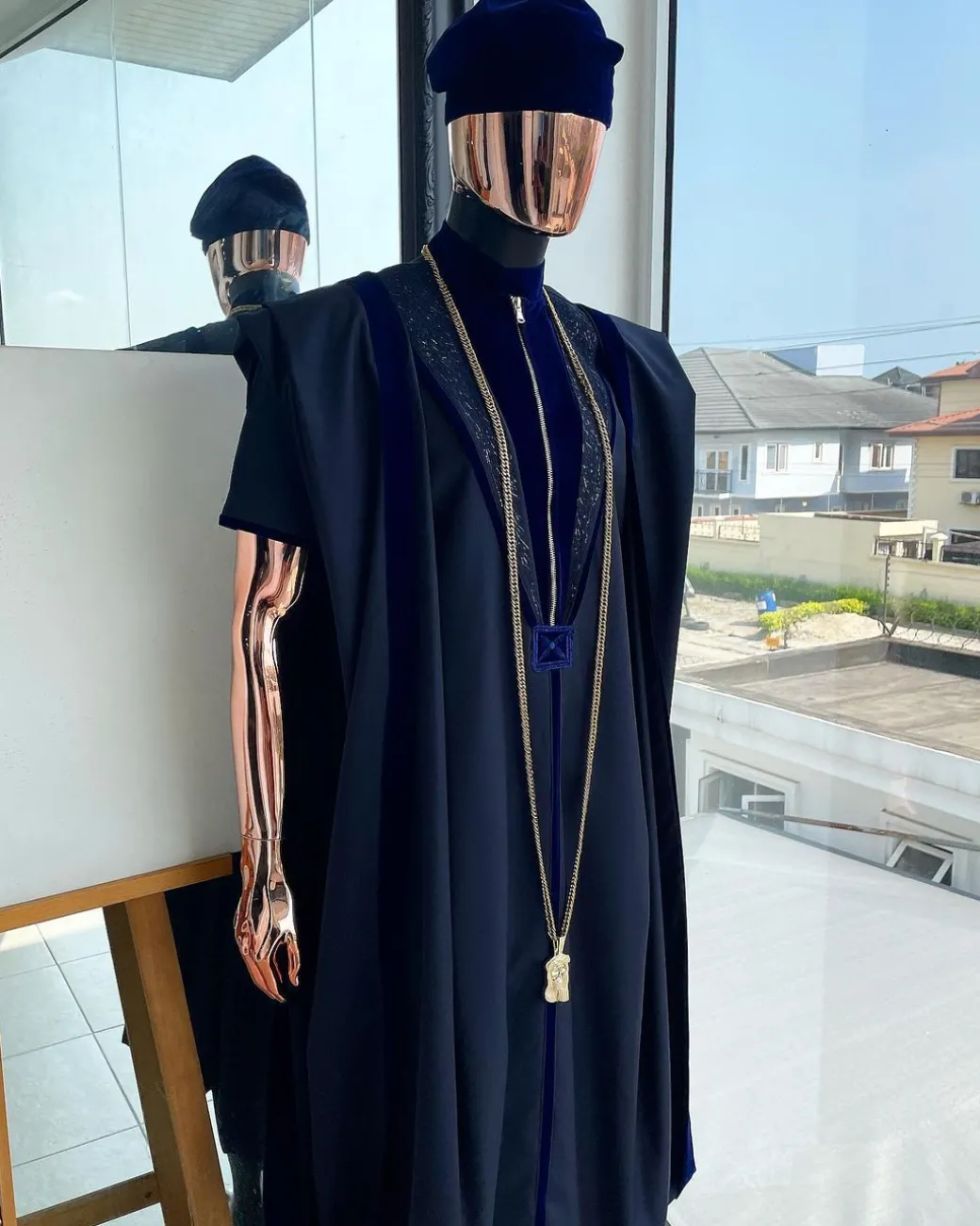 A Midnight blue, vehicular lapelled with zip line flap & navy blue soaked Italian velvet mix embroidery design details agbada