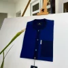 A Mixed shade of blue with a clear view of Swarovski buttons African kaftan and Sokoto