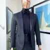A monochrome charcoal black, peak lapel, metallic Jacquard tuxedo suit.