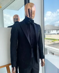 A monochrome charcoal black, peak lapel, metallic Jacquard tuxedo suit.