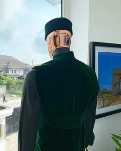 A monochrome forest green long senator kaftan, Soaked premium velvet kimono with Black Swarovski button details & matching velvet round cap.