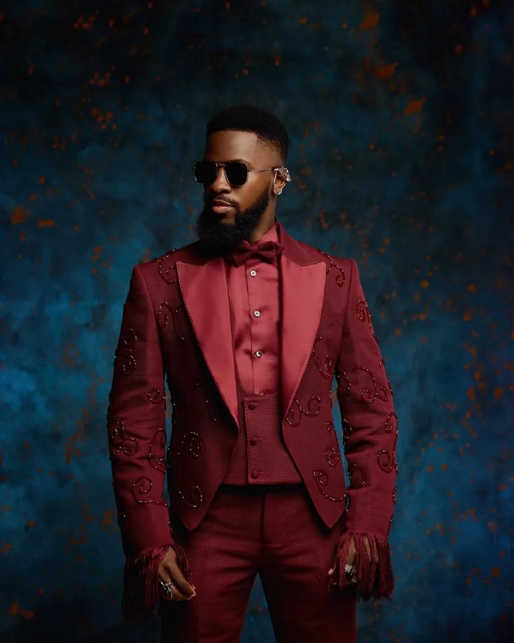 A monochrome, knitted, hand-woven aso-oke, matching bead layering tuxedo suit