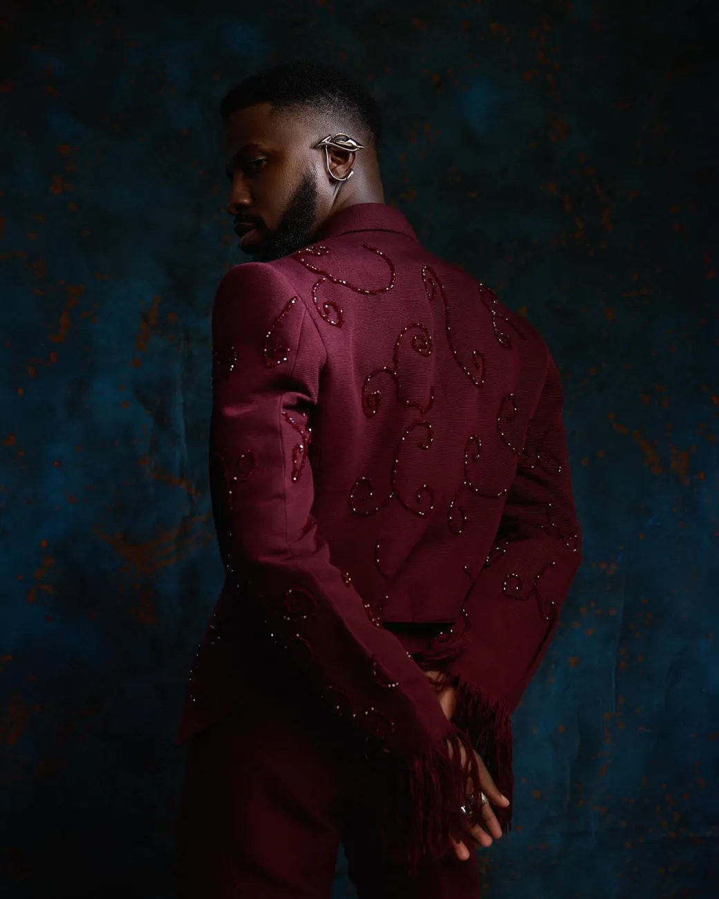 A monochrome, knitted, hand-woven aso-oke, matching bead layering tuxedo suit