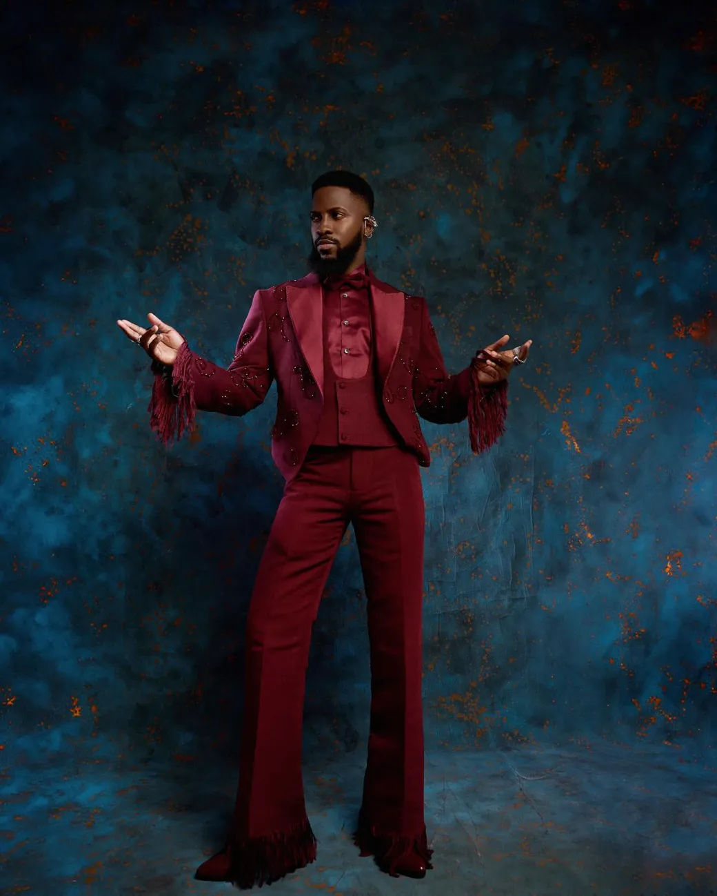 A monochrome, knitted, hand-woven aso-oke, matching bead layering tuxedo suit