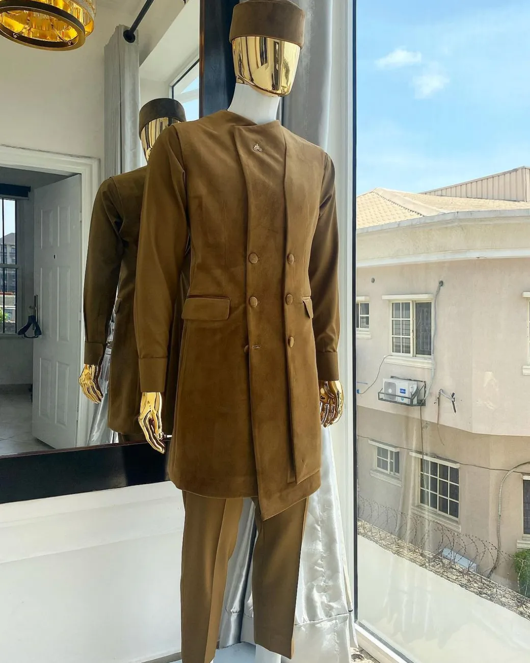 A monochrome light brown Greek military jacket, senator kaftan and sokoto from “Ayeye” Ijade 20/21 “Balogun”