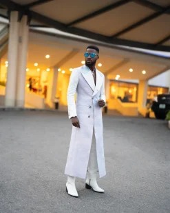 A monochrome, peak lapel, light multi-color dyed trench double breasted jacquard with bunny button details suit