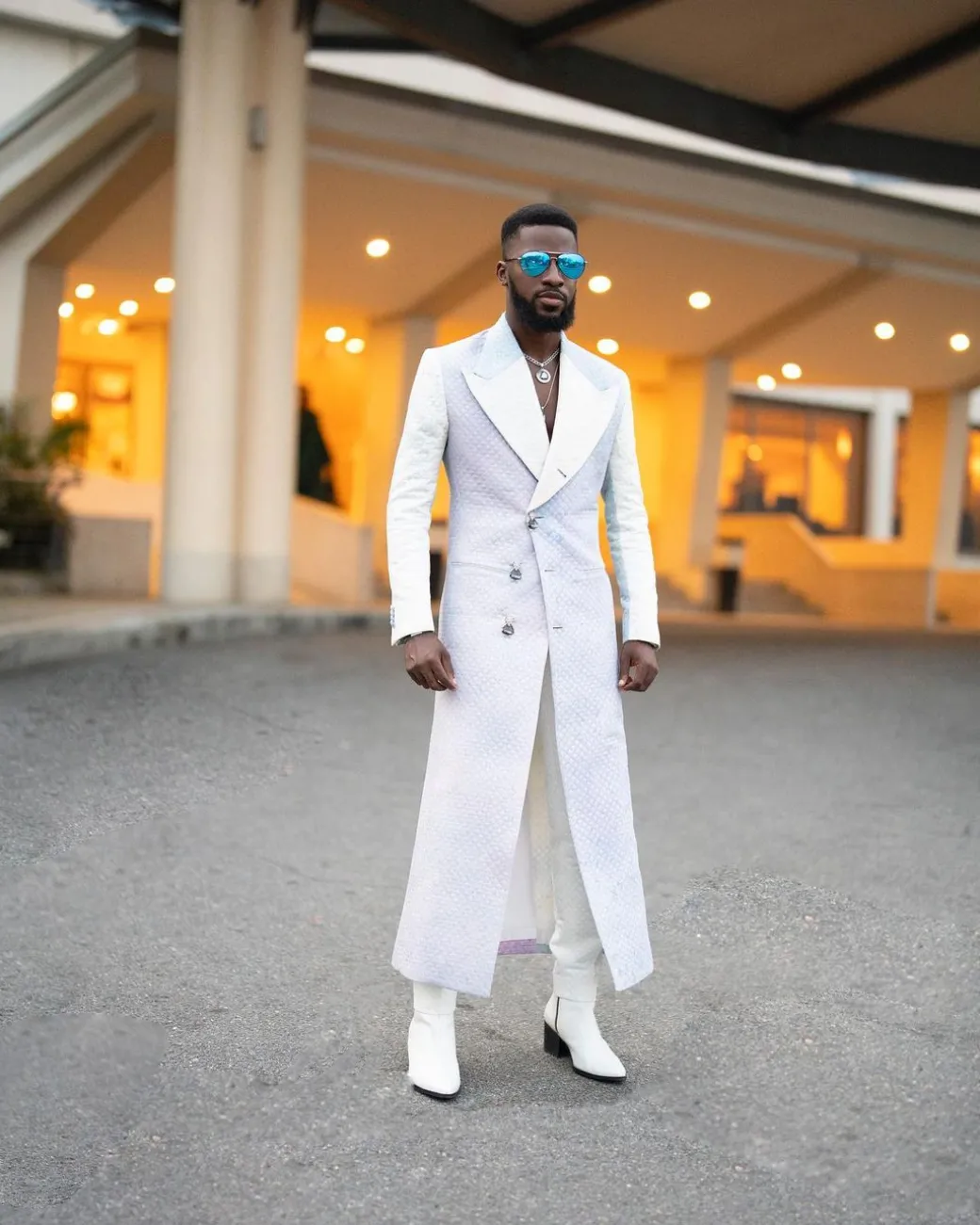 A monochrome, peak lapel, light multi-color dyed trench double breasted jacquard with bunny button details suit