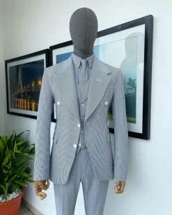 A monochrome seersucker (rail road stripe) notch lapel suit