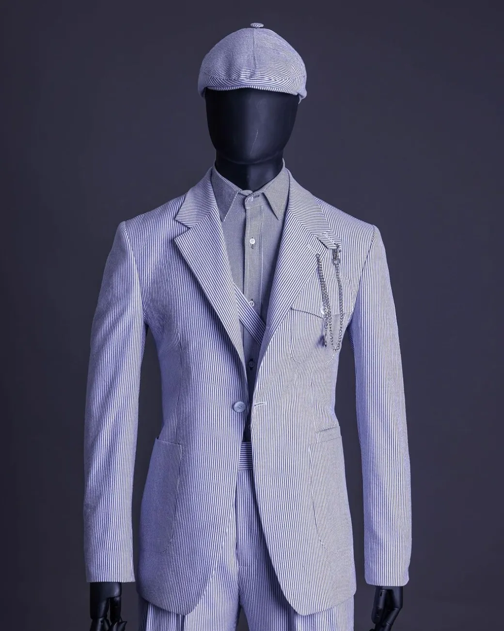 A monochrome seersucker (rail road stripe) notch lapel suit