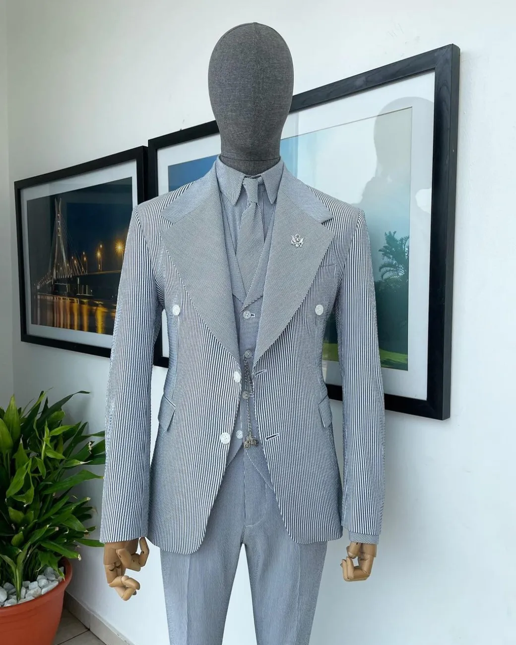 A monochrome seersucker (rail road stripe) notch lapel suit