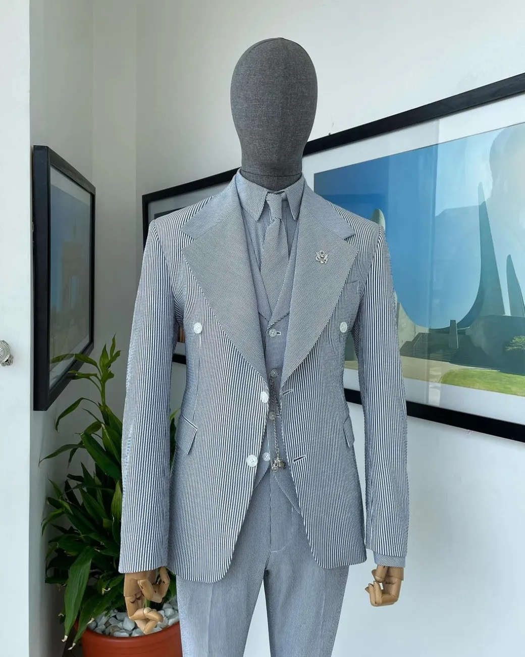 A monochrome seersucker (rail road stripe) notch lapel suit