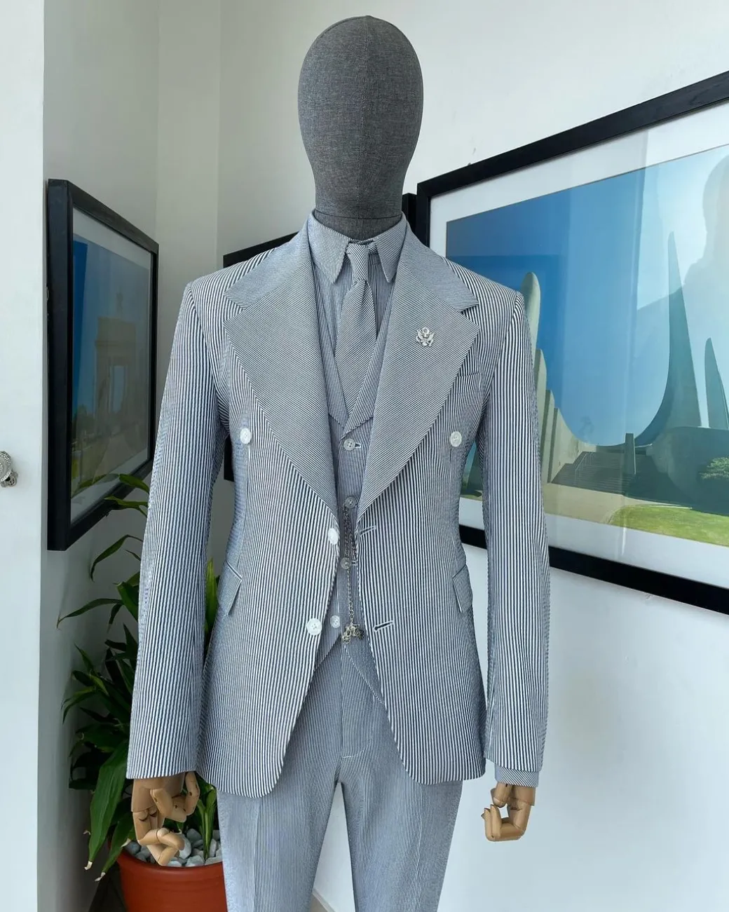 A monochrome seersucker (rail road stripe) notch lapel suit