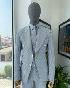 A monochrome seersucker (rail road stripe) notch lapel suit