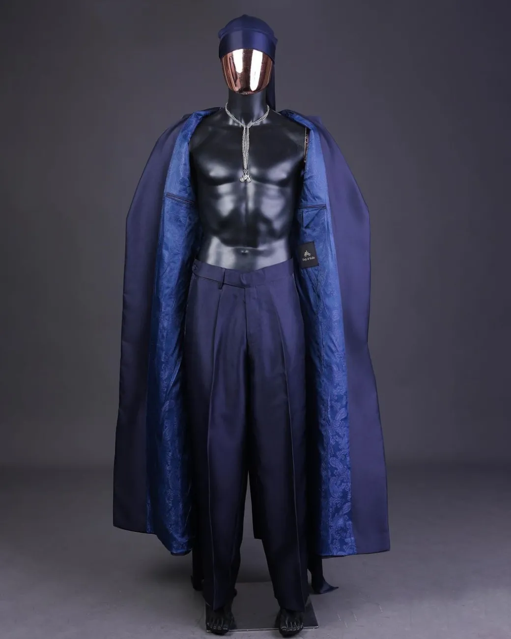 A “Mr Money” navy blue, deconstructed veil on trench silk peak lapel jacket