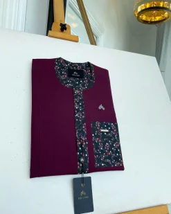 A Mulberry front flap with a clear view of a purple Swarovski button, a paisley-related purple flap and a pocket senator kaftan native
