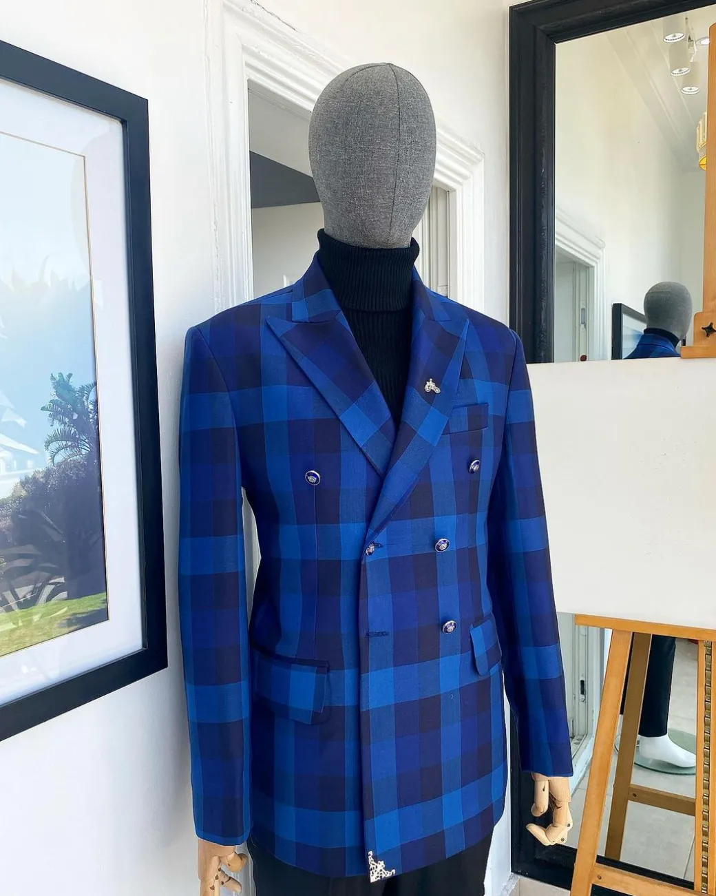 A multicolor shade of blue windowpane check double breasted Peak lapel suit