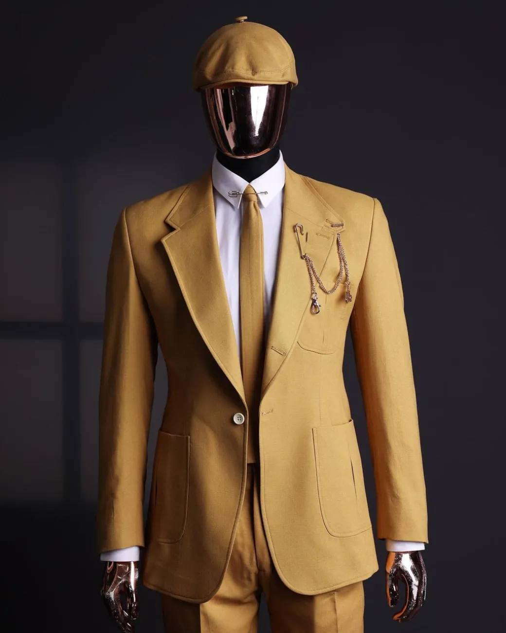 A Mustard Yellow Linen Jacket, Slim Cut Tie, Gurkha Pant Trousers, And Hat