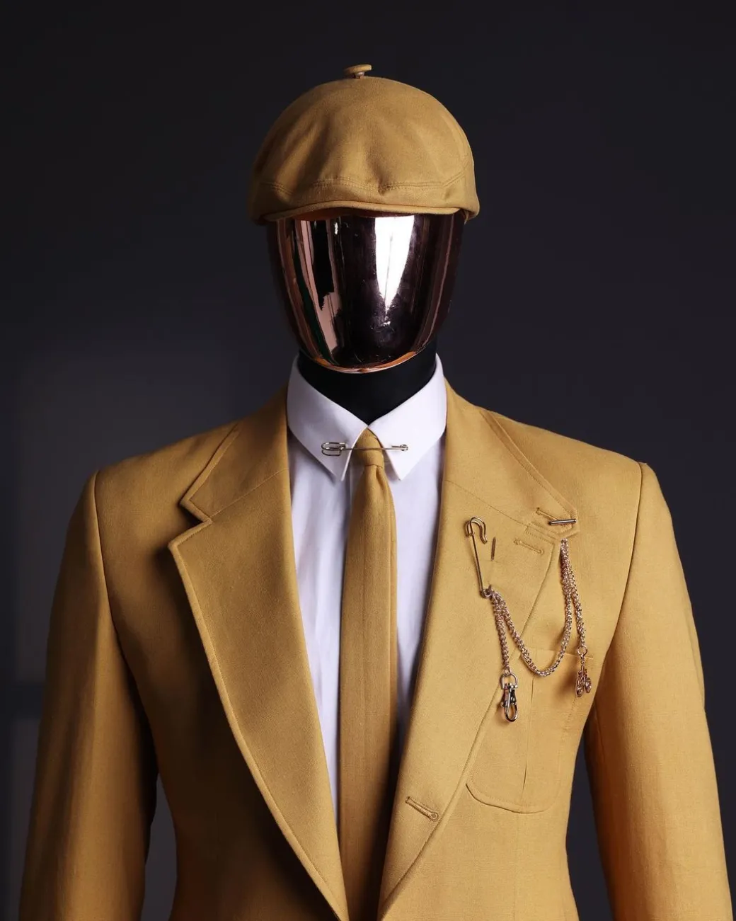 A Mustard Yellow Linen Jacket, Slim Cut Tie, Gurkha Pant Trousers, And Hat