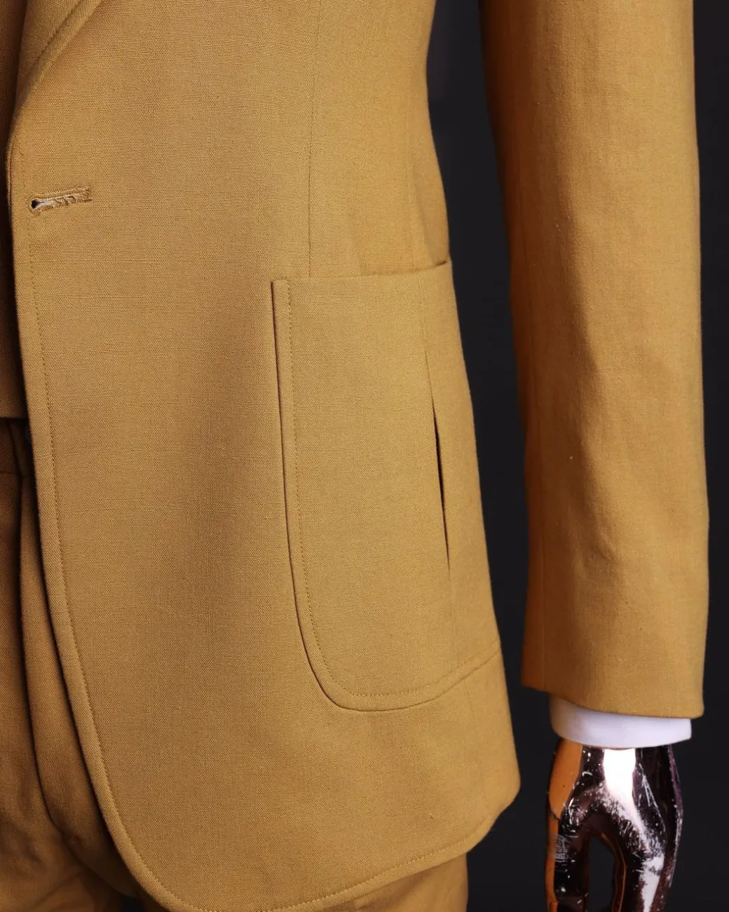 A Mustard Yellow Linen Jacket, Slim Cut Tie, Gurkha Pant Trousers, And Hat