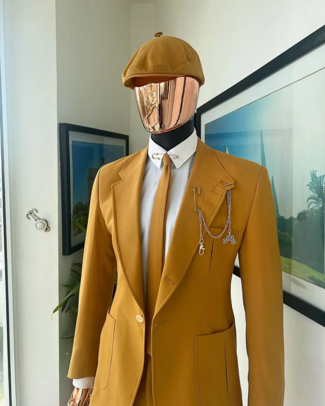 A Mustard Yellow Linen Jacket, Slim Cut Tie, Gurkha Pant Trousers, And Hat