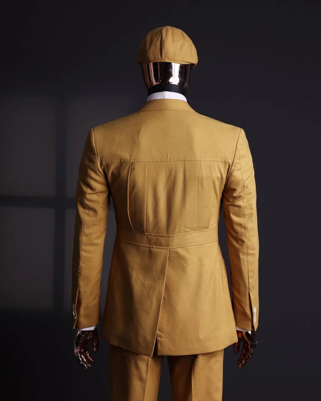 A Mustard Yellow Linen Jacket, Slim Cut Tie, Gurkha Pant Trousers, And Hat