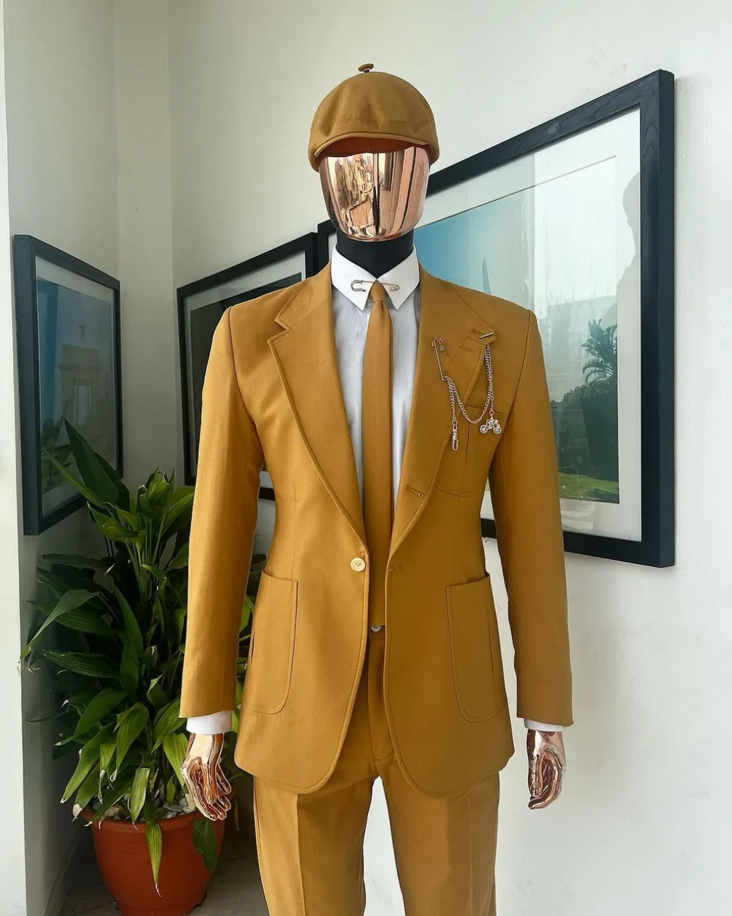 A Mustard Yellow Linen Jacket, Slim Cut Tie, Gurkha Pant Trousers, And Hat