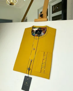 A Mustard Yellow with an interlocking lane design square-shaped buttons African kaftan