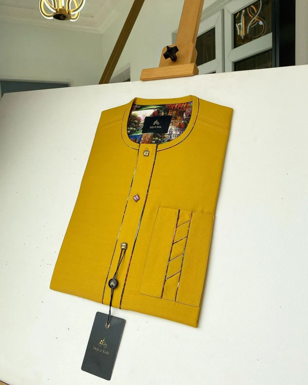 A Mustard Yellow with an interlocking lane design square-shaped buttons African kaftan
