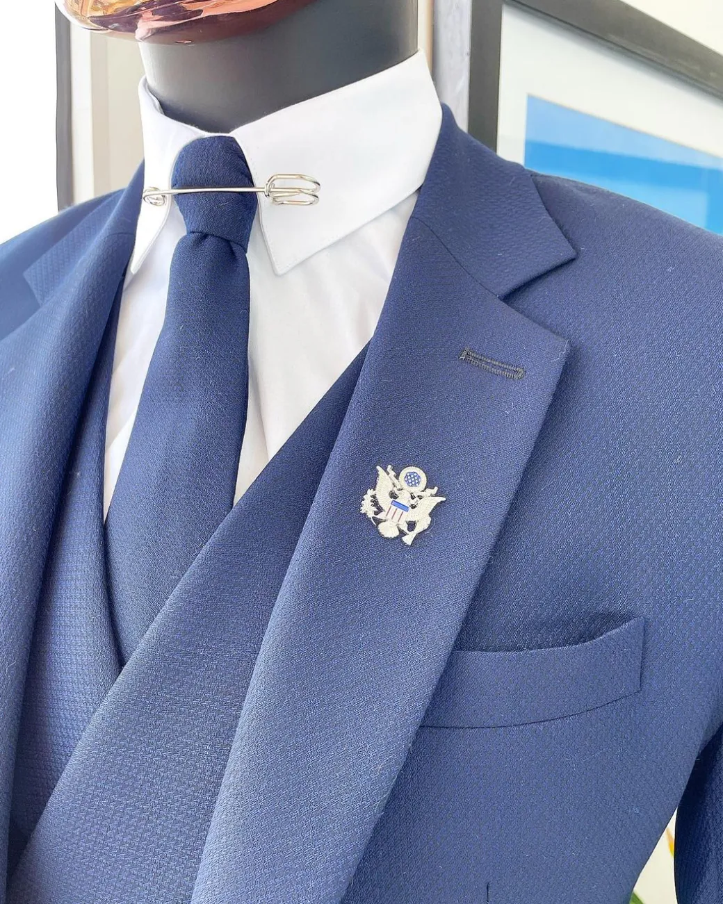 A navy blue – layered square patterned – Jorgecarli super 140’s- “Board Room” notch lapel suit