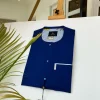 A Navy Blue African kaftan with clear view pearl Swarovski button