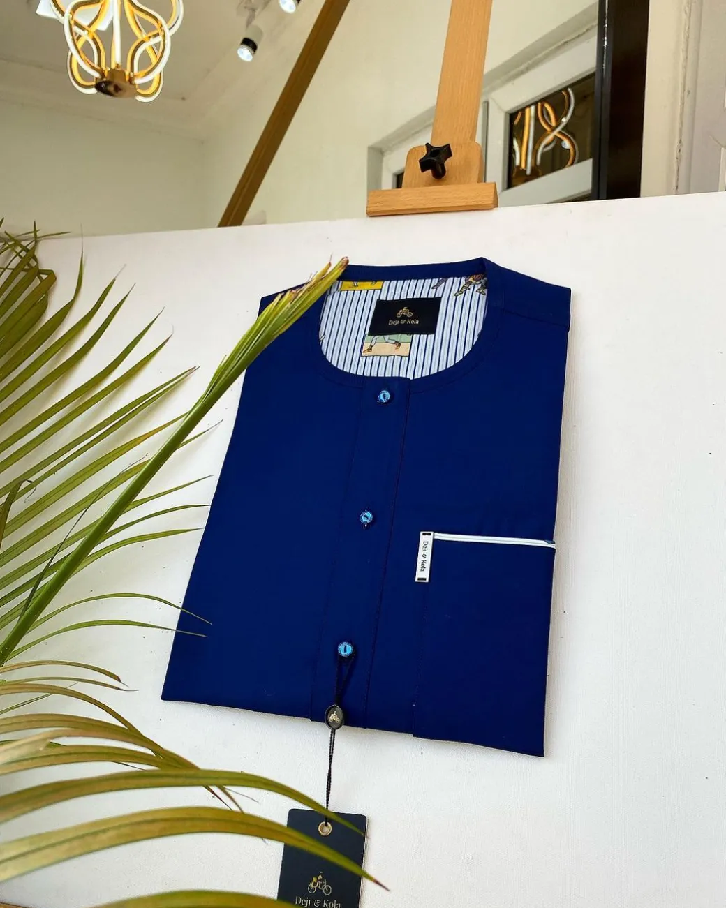A Navy Blue African kaftan with clear view pearl Swarovski button