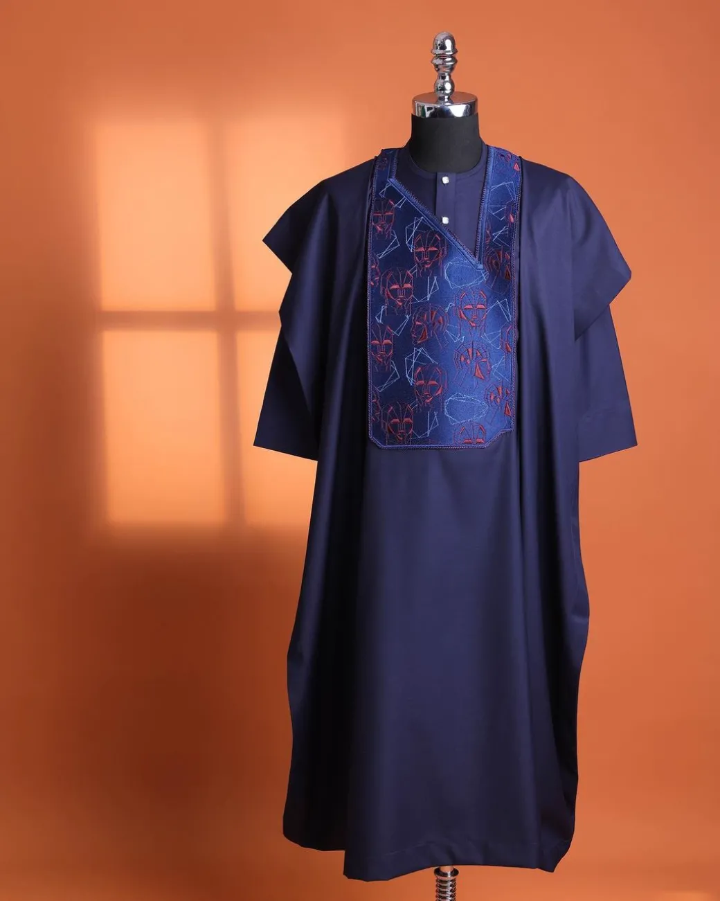 A Navy Blue, AI connected iron-man maze embrodery details agbada