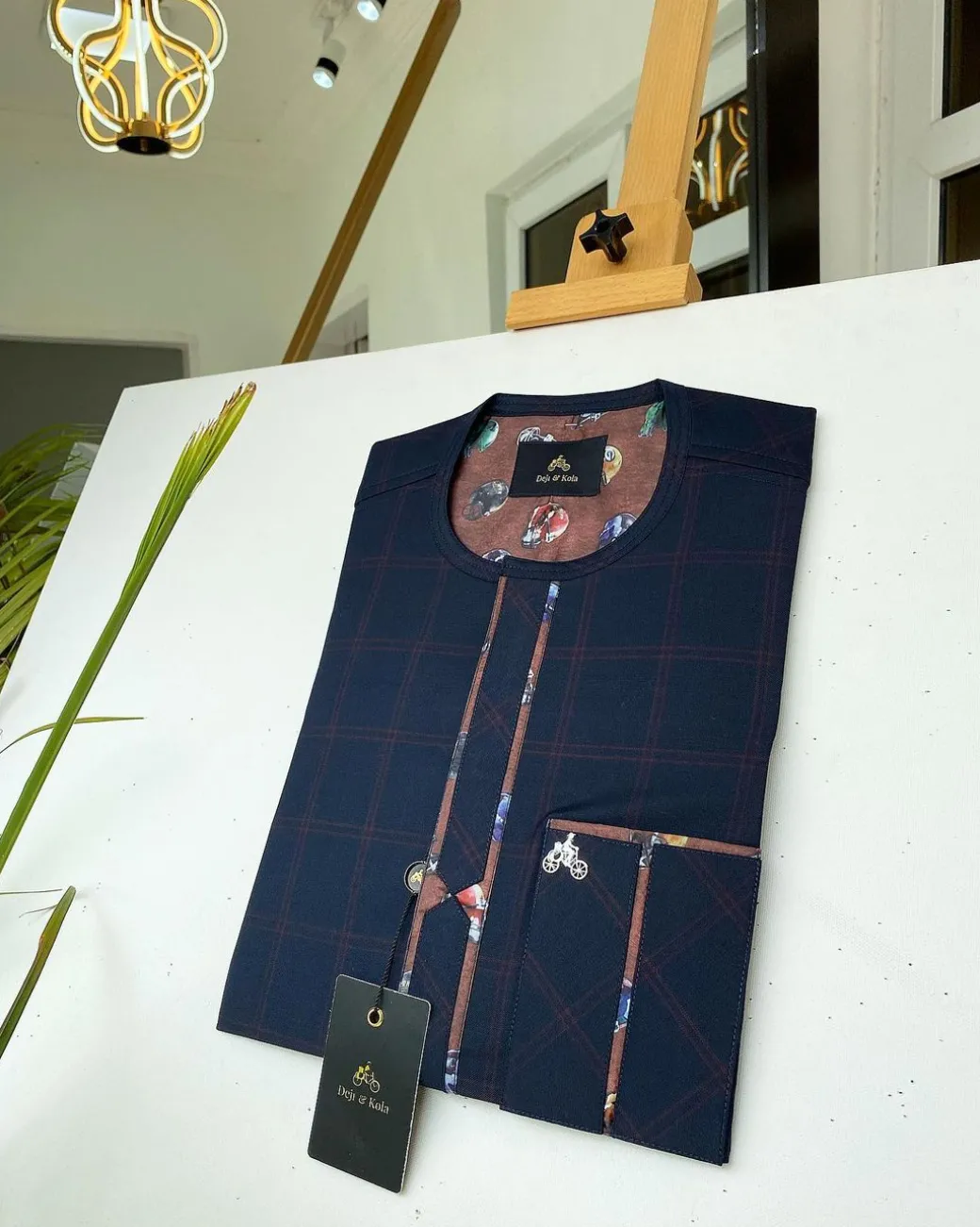 A Navy blue and Onion Check front flap with paisley detailing kaftan.