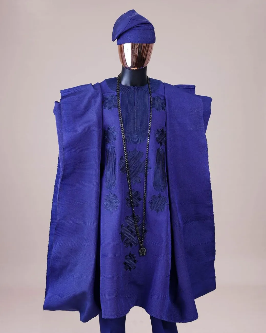 A Navy blue aso-oke, spiral embroidery detailing agbada