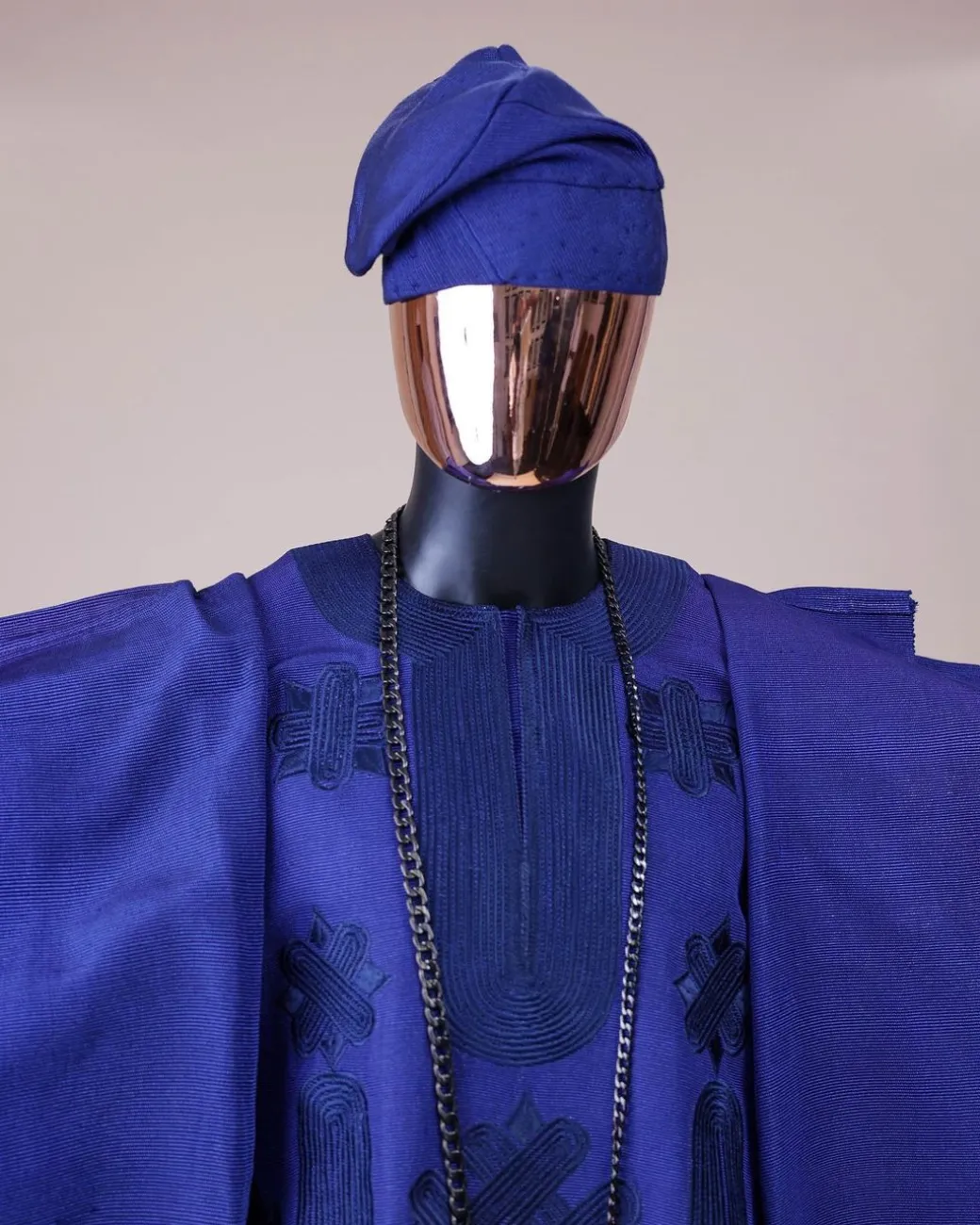 A Navy blue aso-oke, spiral embroidery detailing agbada