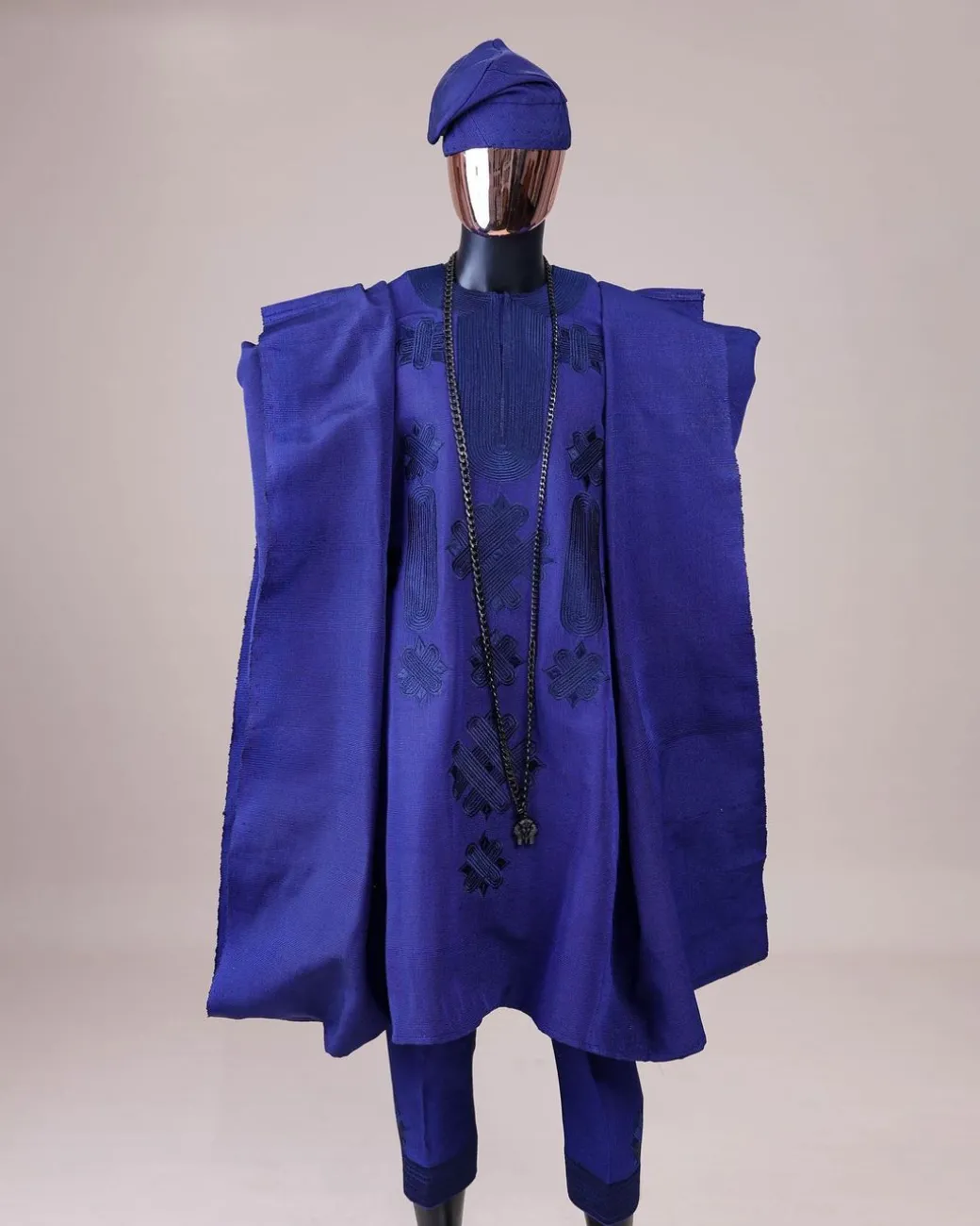 A Navy blue aso-oke, spiral embroidery detailing agbada