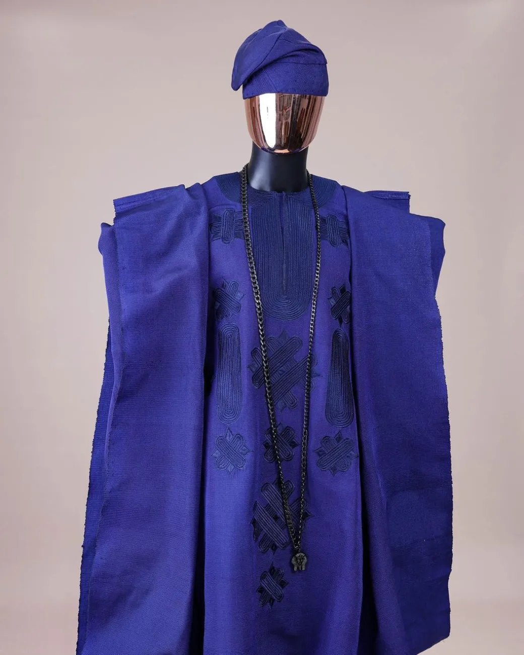 A Navy blue aso-oke, spiral embroidery detailing agbada